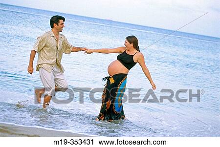 husband with his pregnant wife on the beach View Large Photo Image Stock Image - husband with his pregnant wife on the beach. Fotosearch