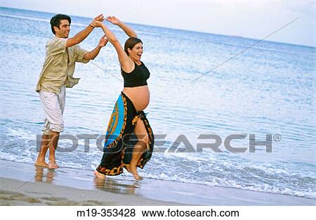 husband with his pregnant wife on the beach View Large Photo Image Stock Photo - husband with his pregnant wife on the beach. Fotosearch