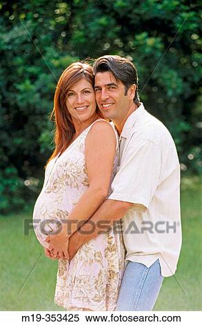 husband with his pregnant wife on the beach View Large Photo Image Stock Photography - husband with his pregnant wife on the beach. Fotosearch