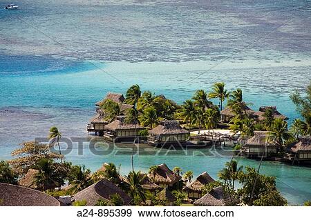Huts at the InterContinental resort, Moorea, Society Islands, French Polynesia (May, 2009) View Large Photo Image Stock Photo - Huts at the InterContinental resort, Moorea, Society Islands, French Polynesia (May, 2009). Fotosearch