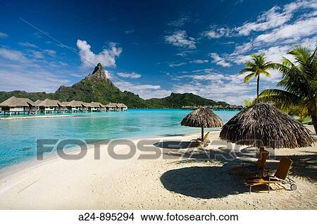 Huts, lagoon and Mount Pahia, Bora Bora island, Society Islands, French Polynesia (May 2009) View Large Photo Image Picture - Huts, lagoon and Mount Pahia, Bora Bora island, Society Islands, French Polynesia (May 2009). Fotosearch
