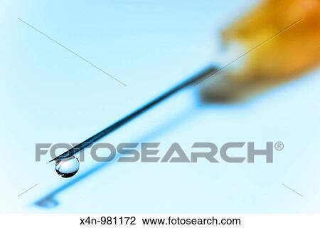 Hypodermic needle with drop of fluid at tip View Large Photo Image Stock Image - Hypodermic needle with drop of fluid at tip. Fotosearch
