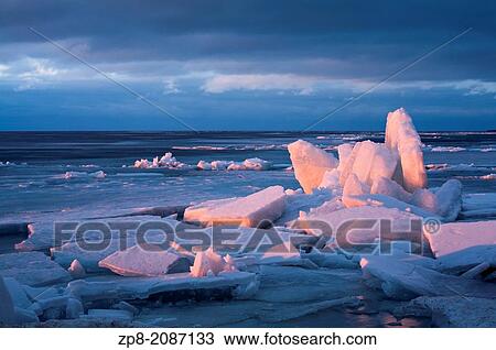 Ice breaking up on Lake Simcoe bathed in the beautiful glow of sunset. Jackson's Point, Lake simcoe, Ontario, Canada. View Large Photo Image Stock Image - Ice breaking up on Lake Simcoe bathed in the beautiful glow of sunset. Jackson's Point, Lake simcoe, Ontario, Canada.. Fotosearch