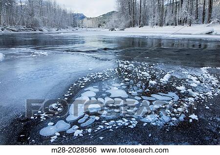 Ice bubbles and frost along the Birkenhead river near Pemberton, Coast Mountains British Columbia. View Large Photo Image Stock Photograph - Ice bubbles and frost along the Birkenhead river near Pemberton, Coast Mountains British Columbia.. Fotosearch