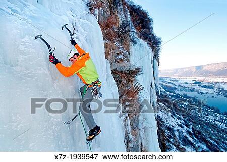 Stock Photo - Ice climbing a route called Chrome Moly which is rated WI-4 and located at the Mother Lode Area in the Snake River Canyon near the city of Twin Falls in southern Idaho. Fotosearch