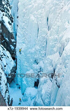 Picture - Ice climbing a route called Hardline which is rated WI-5 at The Ouray Ice Park in the Uncompahgre River Gorge near the town of Ouray in southwestern Colorado.. Fotosearch