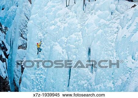 Stock Photography - Ice climbing a route called Hardline which is rated WI-5 at The Ouray Ice Park in the Uncompahgre River Gorge near the town of Ouray in southwestern Colorado.. Fotosearch