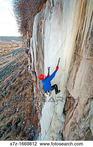 Stock Image - Ice climbing a route called Jack Spratt which is rated WI-5 and located at The Mother Lode area in the Snake River Canyon near the city of Twin Falls in southern Idaho. Fotosearch