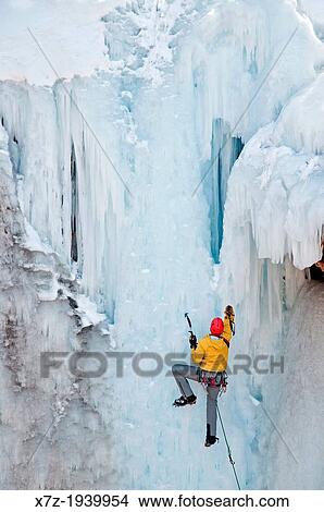 Picture - Ice climbing a route called Le Pissoir which is rated WI-5 at The Ouray Ice Park in the Uncompahgre River Gorge near the town of Ouray in southwestern Colorado.. Fotosearch