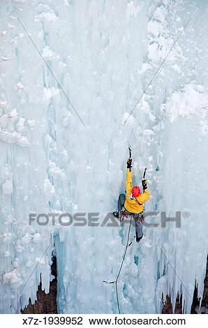 Stock Image - Ice climbing a route called Le Pissoir which is rated WI-5 at The Ouray Ice Park in the Uncompahgre River Gorge near the town of Ouray in southwestern Colorado.. Fotosearch