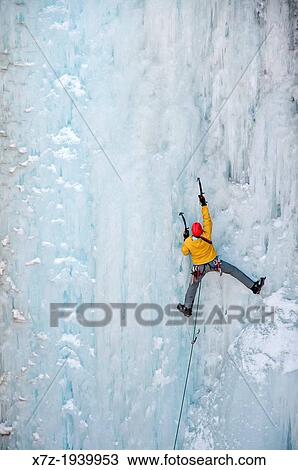 Stock Image - Ice climbing a route called Le Pissoir which is rated WI-5 at The Ouray Ice Park in the Uncompahgre River Gorge near the town of Ouray in southwestern Colorado.. Fotosearch