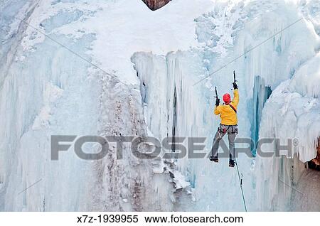 Stock Photography - Ice climbing a route called Le Pissoir which is rated WI-5 at The Ouray Ice Park in the Uncompahgre River Gorge near the town of Ouray in southwestern Colorado.. Fotosearch