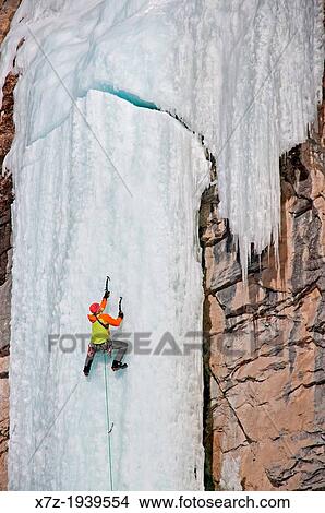 Picture - Ice climbing a route called The Boy Scout which is rated WI, 4-5 and located in Lamoille Canyon in The Ruby Mountains in northeastern Nevada. Fotosearch