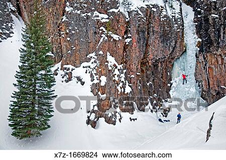 Ice climbing a route called The Elevator Shaft which is rated WI-4 and located at the Unnamed Wall in Hyalite Canyon near the city of Bozeman in southern Montana View Large Photo Image Picture - Ice climbing a route called The Elevator Shaft which is rated WI-4 and located at the Unnamed Wall in Hyalite Canyon near the city of Bozeman in southern Montana. Fotosearch