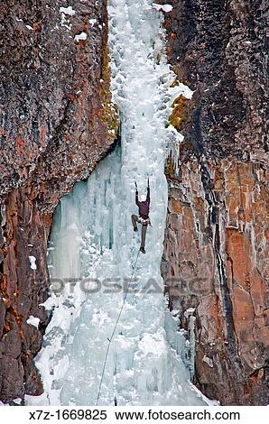 Ice climbing a route called The Elevator Shaft which is rated WI-4 and located at the Unnamed Wall in Hyalite Canyon near the city of Bozeman in southern Montana View Large Photo Image Stock Photography - Ice climbing a route called The Elevator Shaft which is rated WI-4 and located at the Unnamed Wall in Hyalite Canyon near the city of Bozeman in southern Montana. Fotosearch