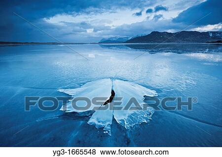 Stock Photo - Ice formation of frozen coast of Ytterpollen, Lofoten Islands, Norway. Fotosearch