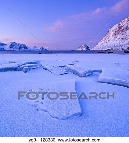 Ice on Haukland beach in winter, Vestvagoy, Lofoten islands, Norway View Large Photo Image Stock Image - Ice on Haukland beach in winter, Vestvagoy, Lofoten islands, Norway. Fotosearch