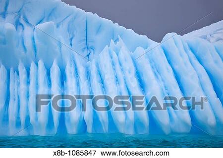 Iceberg detail in and around the Antarctic Peninsula during the summer months, Southern Ocean MORE INFO An increasing number of icebergs is being created as climate change is causing the breakup of major ice shelves and glaciers View Large Photo Image Stock Photo - Iceberg detail in and around the Antarctic Peninsula during the summer months, Southern Ocean MORE INFO An increasing number of icebergs is being created as climate change is causing the breakup of major ice shelves and glaciers. Fotosearch