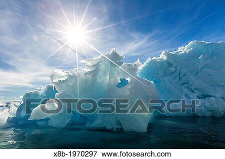 Iceberg in Port Lockroy, western side of the Antarctic Peninsula, Southern Ocean. View Large Photo Image Stock Photo - Iceberg in Port Lockroy, western side of the Antarctic Peninsula, Southern Ocean.. Fotosearch