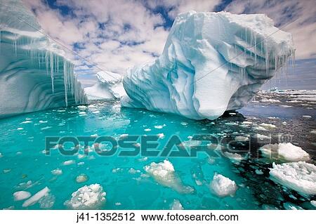 Stock Image - Iceberg with icicles, Penola Strait, Antarctic Peninsula.. Fotosearch
