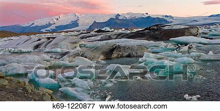 Icebergs Sunrise at JokulsBrl? n Glacier Lagoon Iceland. View Large Photo Image Stock Photo - Icebergs Sunrise at JokulsBrl? n Glacier Lagoon Iceland.. Fotosearch