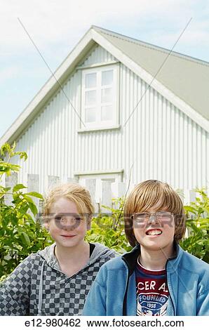 Iceland, Eyrarbakki village old houses, kids playing in the street with bicycle. View Large Photo Image Stock Image - Iceland, Eyrarbakki village old houses, kids playing in the street with bicycle.. Fotosearch