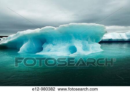 Iceland, Jokulsarlon glacier, icebergs floating on water. View Large Photo Image Stock Image - Iceland, Jokulsarlon glacier, icebergs floating on water.. Fotosearch