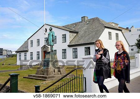 Stock Image - Iceland, Rekjavik, Walking down Bokhlodustigur street. Fotosearch