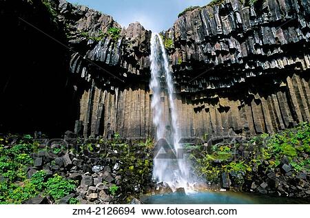 ICELAND, SOUTH COAST, SKAFTAFELL NATIONAL PARK, SVARTIFOSS WATERFALL, BASALT COLUMNS. View Large Photo Image Picture - ICELAND, SOUTH COAST, SKAFTAFELL NATIONAL PARK, SVARTIFOSS WATERFALL, BASALT COLUMNS.. Fotosearch