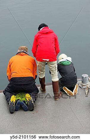 Icelandic people love to fish directly from waters of Atlantic Ocean, they don? t even need a rod for fishing, they just fish using very simple tool - piece of wood wrapped with fishing plastic line ended with hook with corn or shrimp View Large Photo Image Stock Photograph - Icelandic people love to fish directly from waters of Atlantic Ocean, they don? t even need a rod for fishing, they just fish using very simple tool - piece of wood wrapped with fishing plastic line ended with hook with corn or shrimp. Fotosearch
