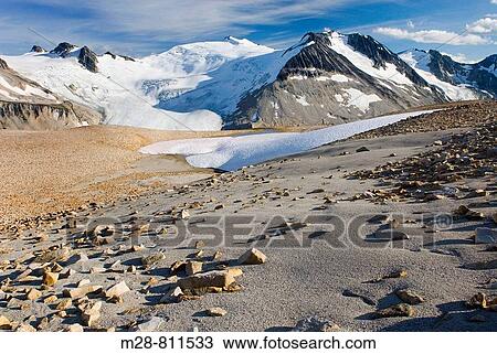 Icemaker Mountain left 2745 m 9006 ft and Mount Guthrum 2695 m 8842 ft seen from pumice covered slopes above Athelney Pass, Coast Mountains British Columbia Canada View Large Photo Image Stock Image - Icemaker Mountain left 2745 m 9006 ft and Mount Guthrum 2695 m 8842 ft seen from pumice covered slopes above Athelney Pass, Coast Mountains British Columbia Canada. Fotosearch