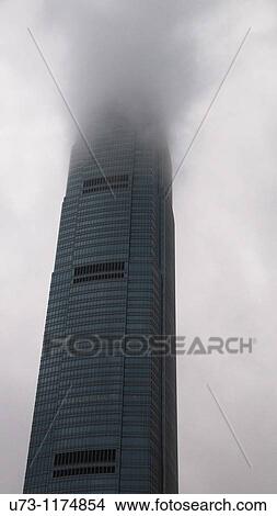 IFC tower in Hong Kong covered with clouds. View Large Photo Image Picture - IFC tower in Hong Kong covered with clouds.. Fotosearch