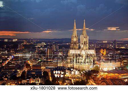 Stock Photo - illuminated Cologne Cathedral during the blue hour, Cologne, North Rhine-Westphalia, Germany, Europe. Fotosearch