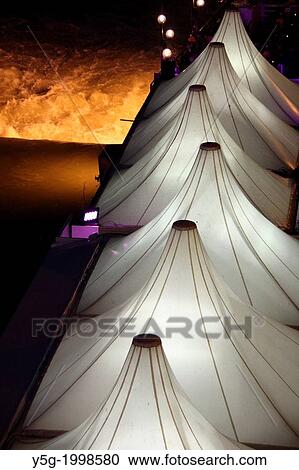 Stock Image - illuminated tents byy the tiber river in rome italy.. Fotosearch