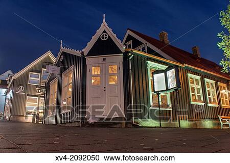 Stock Image - Iluminated streets of Reykjavik old town, city centre by night. Iceland.. Fotosearch