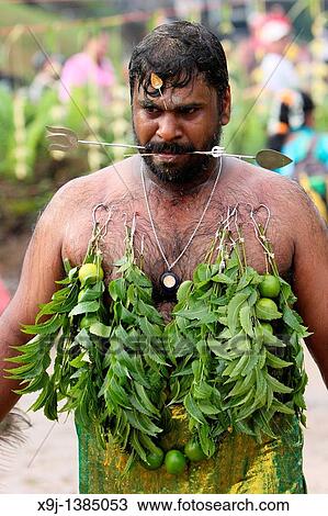 Stock Image - Image of a Hindu devotee, Malaysia, Kuching, Thaipusam Hindu festival. Fotosearch
