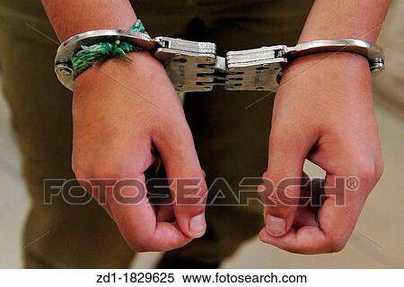 Image of a man arrested in a court room View Large Photo Image Stock Photography - Image of a man arrested in a court room. Fotosearch