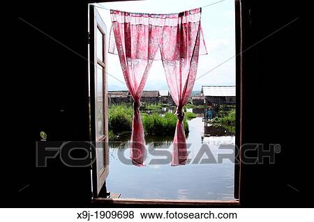 Stock Photo - Image of Inle lake, house and boat, Shan states, Burma. Fotosearch
