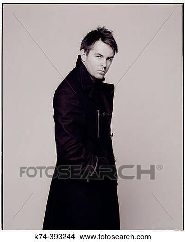 Image of man in long coat View Large Photo Image Picture - Image of man in long coat. Fotosearch