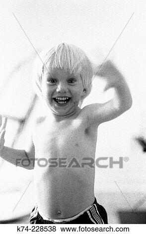 image of young boy smiling and waving at camera View Large Photo Image Stock Photo - image of young boy smiling and waving at camera. Fotosearch