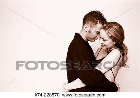 image of young couple embracing View Large Photo Image Stock Image - image of young couple embracing. Fotosearch