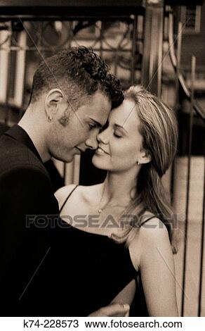image of young couple embracing View Large Photo Image Stock Image - image of young couple embracing. Fotosearch