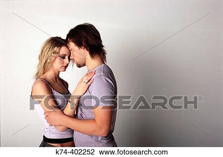 image of young couple embracing View Large Photo Image Stock Image - image of young couple embracing. Fotosearch