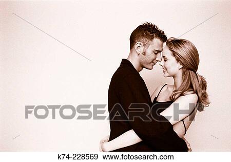 Stock Photo - image of young couple embracing. Fotosearch