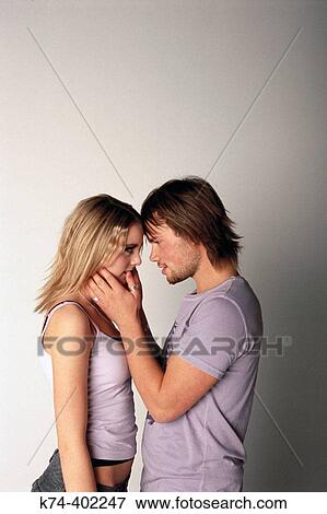 Stock Photo - image of young couple embracing. Fotosearch