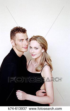 Stock Photo - image of young couple embracing. Fotosearch