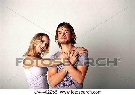 Stock Photograph - image of young couple embracing. Fotosearch