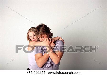 image of young couple embracing View Large Photo Image Stock Photography - image of young couple embracing. Fotosearch