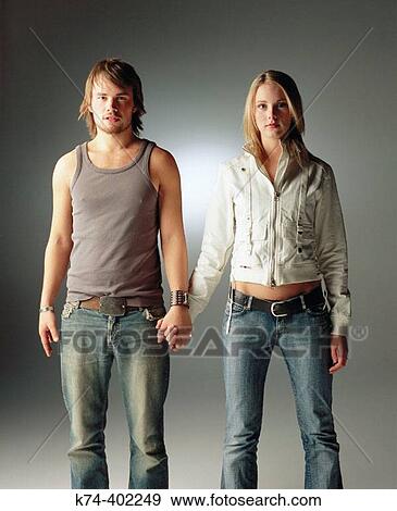 image of young couple holding hands View Large Photo Image Stock Photo - image of young couple holding hands. Fotosearch
