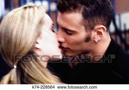 image of young couple kissing View Large Photo Image Picture - image of young couple kissing. Fotosearch